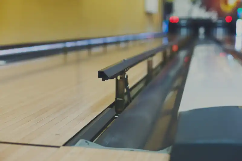 Bumper Bowling Banner Bowling alley background. Lane with bumper rails closeup. Leisure activity club